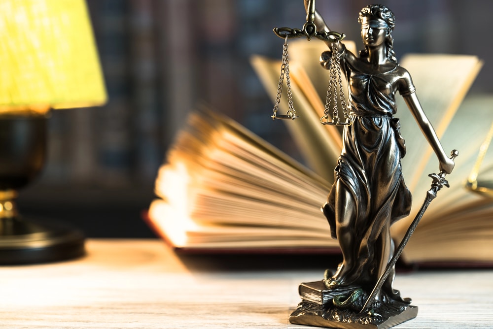 Assault & Battery Defense Lawyers Portrayed by Lady Justice and legal text