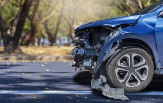 Statute of Limitations on Car Accident Injury Claims in Kansas portrayed by blue car in a front end accident.