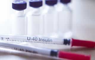 Legal Rights of detention center Prisoners and Detainees with Diabetes in Kansas portrayed by U-40 Insulin syringes meant for detention center inmates in Kansas.